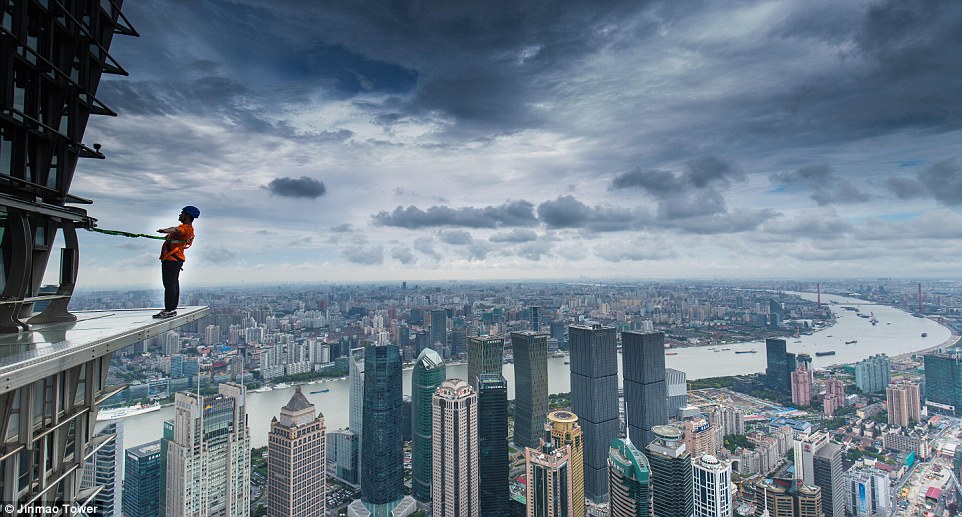 Adrenaline running high: Jinmao Tower, a 88-storey skyscraper in Shanghai, has built a glass-bottom walkway on the top floor