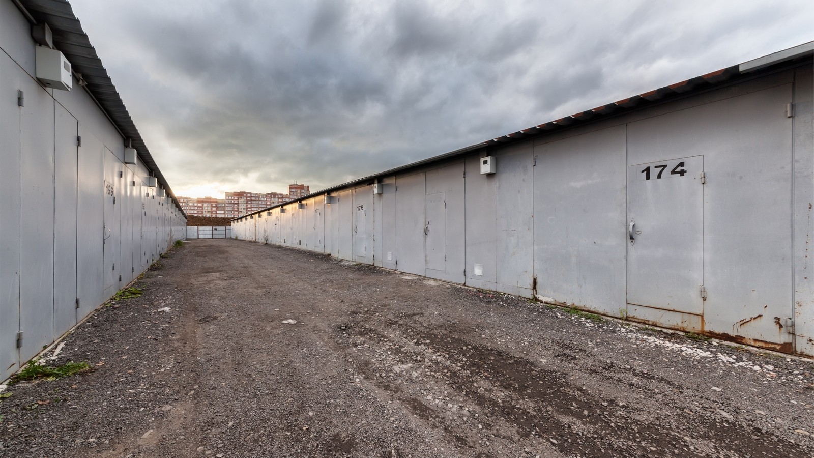 Gated garage complex on the background of stormy sky